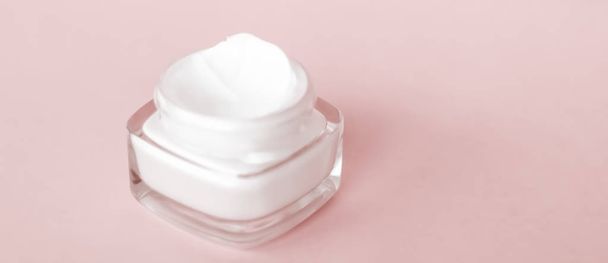 Face cream moisturizer jar on beige background, moisturizing ski - Photo, Image