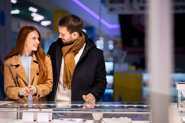 young caucasian married couple enjoy choosing jewelry for female - Zdjęcie, obraz