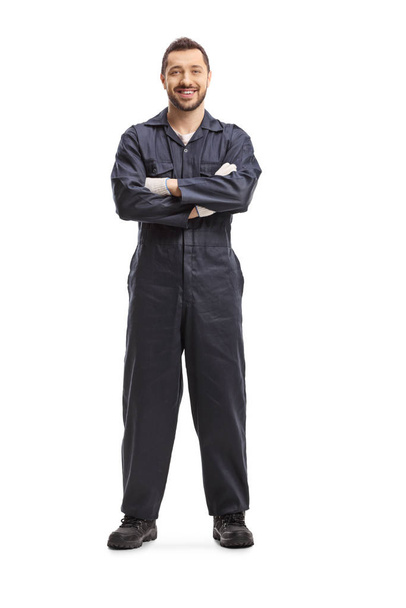 Mechanic in a dark blue overalls  - 写真・画像
