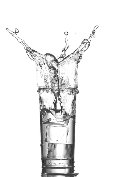 Glass of water with ice cubes isolated on white background - Valokuva, kuva