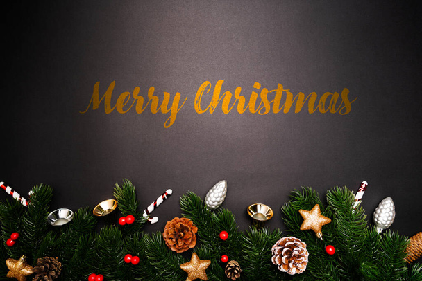 Christmas pine tree with xmas decoration on black background - Fotografie, Obrázek