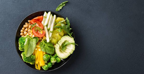 Vegan buddha bowl. Healthy vegetable lunch on dark background. Top view - Valokuva, kuva