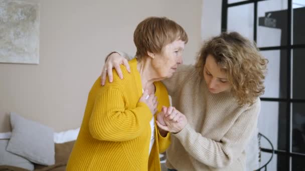 Young Woman Taking Care Of Senior Woman. Family Care. - Materiał filmowy, wideo