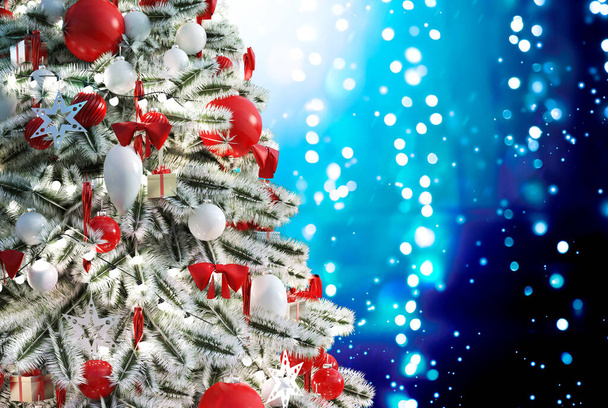 Christmas tree against a glittery luminous background - Photo, Image