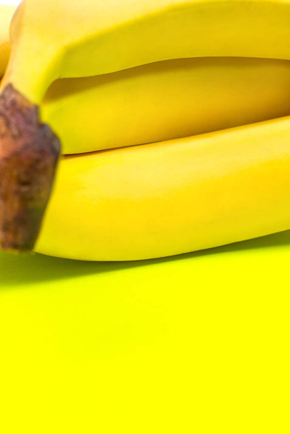 Ripe banana for diet and exercise on a green background - Φωτογραφία, εικόνα