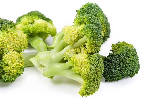 Branches of fresh broccoli on a white background close-up - Foto, Imagen