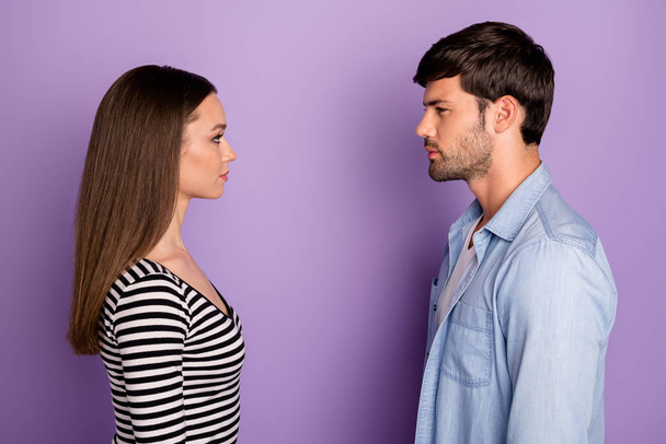 Profile photo of two people couple guy lady standing opposite looking eyes have conflict situation wear stylish casual outfit isolated pastel purple color background - Photo, Image