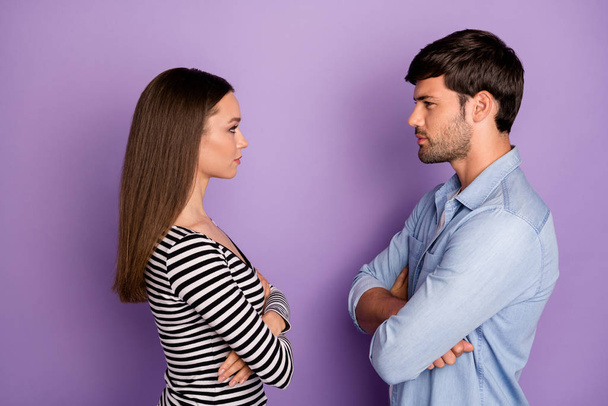 Profile photo of two people couple guy lady standing opposite angry looking eyes arms crossed had fight wear stylish casual outfit isolated pastel purple color background - Photo, Image