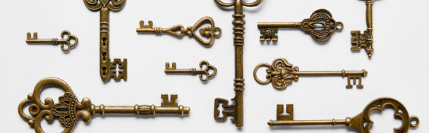 top view of vintage keys on white background, panoramic shot - Photo, Image
