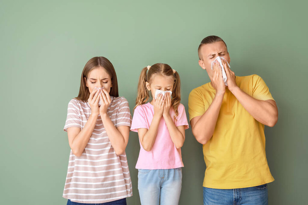 Family suffering from allergy on color background - Photo, Image