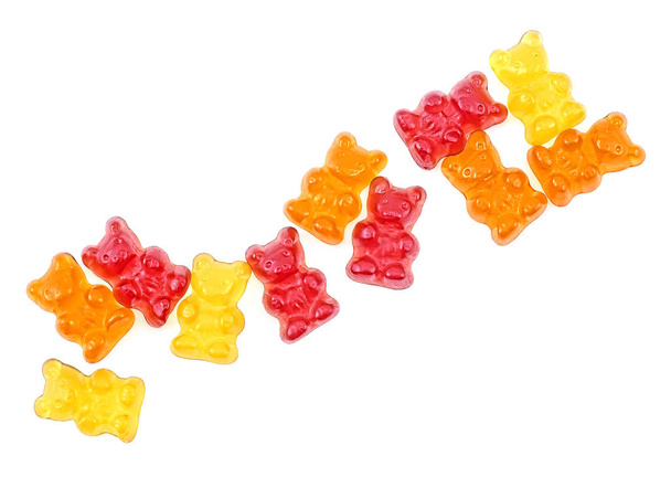 Colorful eat gummy bears isolated on a white background, top vie - 写真・画像