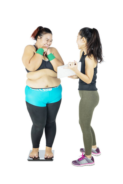 Fat Asian woman received her improvements happily - Fotó, kép