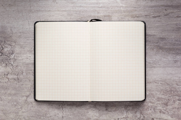 notepad or notebook paper at stone background - Φωτογραφία, εικόνα