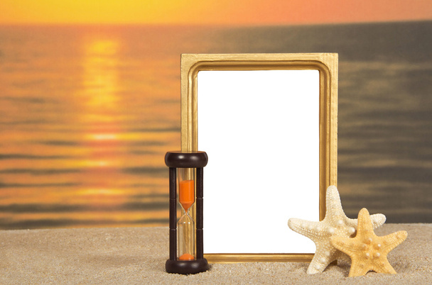 Frame, set of sea cockleshells, hourglasses against a decline - Photo, Image
