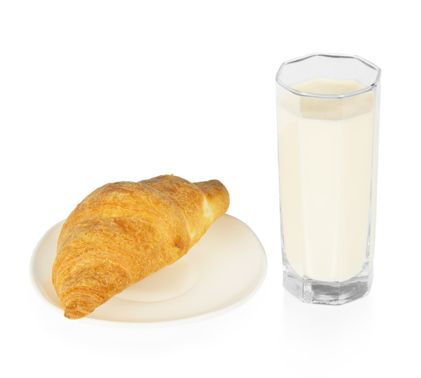 Croissant on a saucer and the glass of milk isolated on white - Fotó, kép