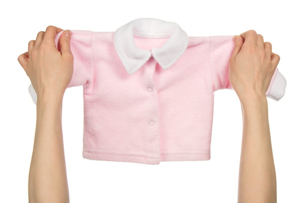 Children's jacket with buttons in the female hands, isolated on white - Photo, Image