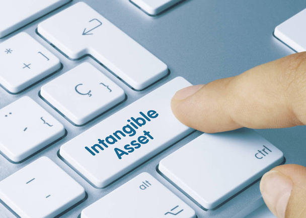 Intangible Asset - Inscription on White Keyboard Key. - Photo, Image