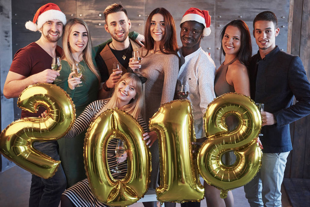 New 2018 Year is coming! Group portrait of Cheerful old friends communicate with each other. The party is devoted to the celebration of the new year. Concepts about youth togetherness lifestyle. - Photo, Image