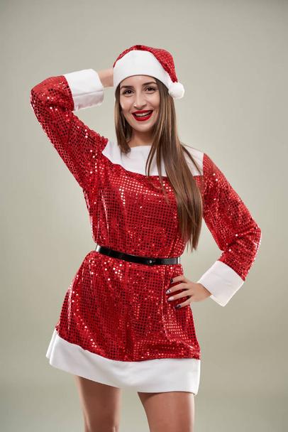 Beautiful young woman as Santa helper in red costume - Φωτογραφία, εικόνα