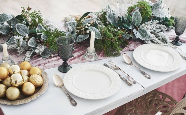 Table served for Christmas dinner in living room, top view. - Photo, image