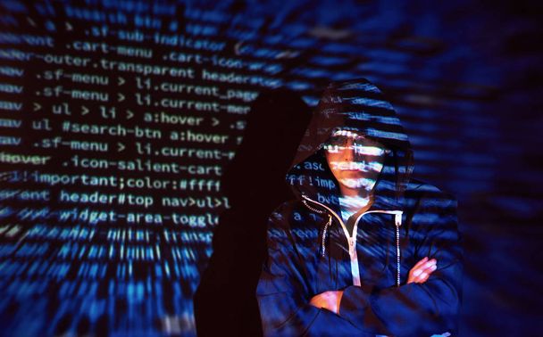 Cyber attack with unrecognizable hooded hacker using virtual reality, digital glitch effect. - Foto, imagen