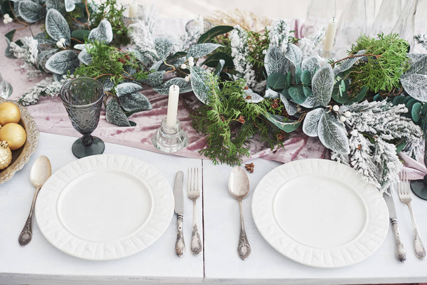 Table served for Christmas dinner in living room, top view. - 写真・画像