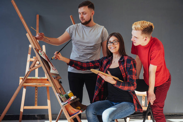 Group of students painting at art lessons. - Φωτογραφία, εικόνα