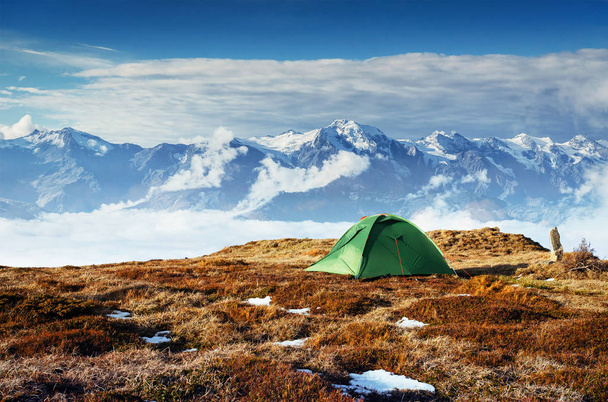 Tent against the backdrop of snow-capped mountain peaks. The view from the mountains to Mount Ushba Mheyer, Georgia. Europe. - Φωτογραφία, εικόνα