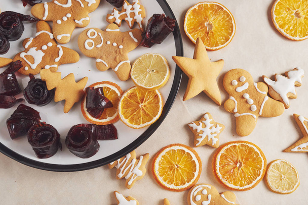 Decorating gingerbread cookies with white icing, selective focus and place for text. - Фото, зображення