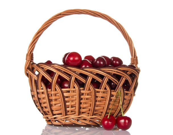 Full basket of ripe sweet cherry and some berries near - Foto, Imagem