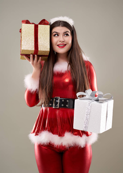 Beautiful young Santa girl with presents to give - Zdjęcie, obraz