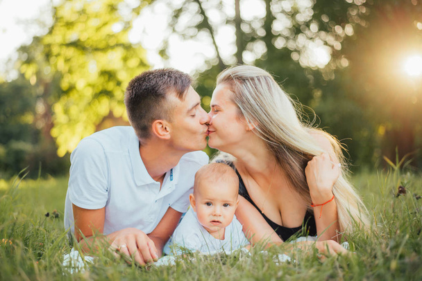 happy family with baby son at summer  - Foto, Bild