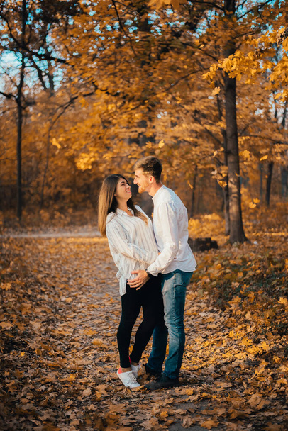 happy young couple hugging in autumn park - Photo, image