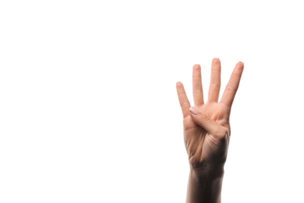 vista ritagliata della donna che mostra quattro dita isolate sul bianco
  - Foto, immagini