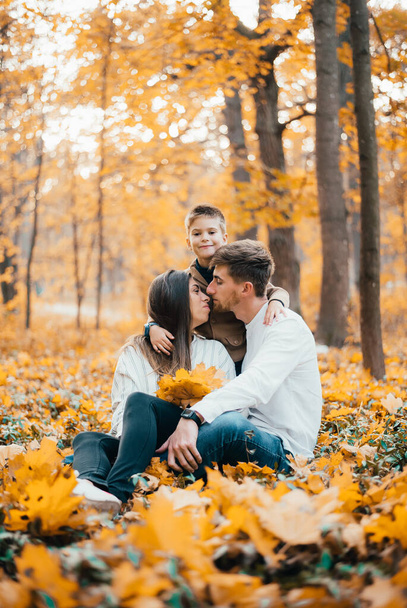 happy young family spending time together in autumn forest - Valokuva, kuva