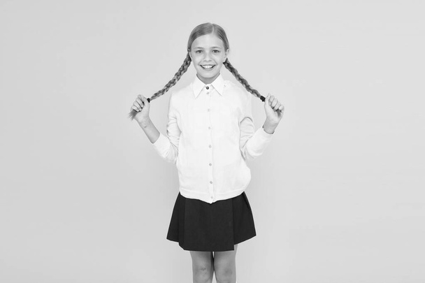 Educational activity. Homeschooling or visiting regular school. Efficiency of studying. Adorable schoolgirl. Happy schoolgirl. Schoolgirl happy smiling pupil long hair. Beginning of academic year - Photo, Image