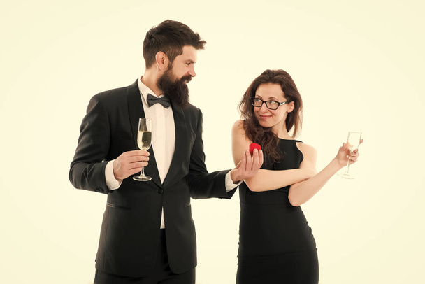 happy man in tuxedo do proposal to sexy woman. couple in love celebrate engagement with champagne. wedding is soon. love couple. Can not believe this is happening. Ring is perfect. Will you marry me - Zdjęcie, obraz