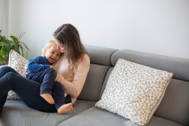 Mother, tickling her little toddler boy, child giggling at home  - Fotoğraf, Görsel