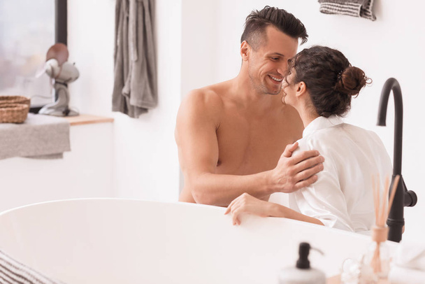 Happy young couple in bathroom at home - Photo, Image
