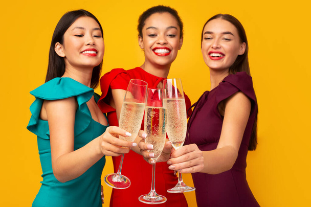 Three Girls With Champagne having Party Clinking Glasses In Studio - Fotografie, Obrázek