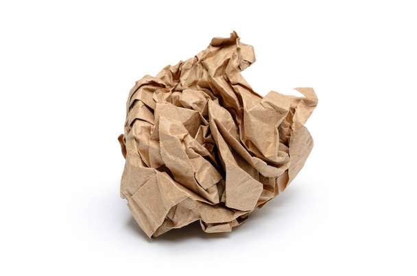 Sheet of paper crumpled into a lump on white background. - Fotografie, Obrázek