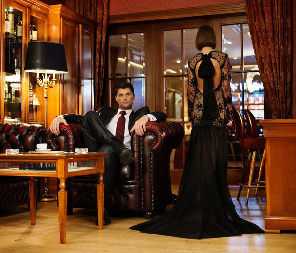 Elegant couple in formal dress in luxury cabinet - Foto, Imagem