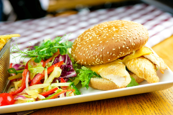 close-up view of tasty hamburger and fries, fast food concept - Fotografie, Obrázek