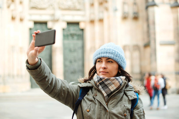 Woman take selfie portrait in city. Travel, lifestyle and people - Photo, Image
