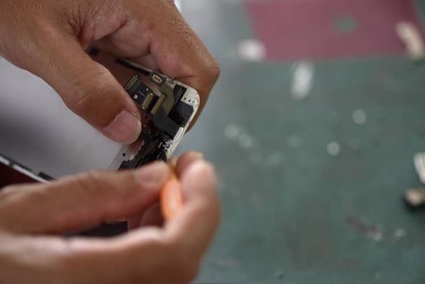 close up of man repairing smartphone   - Photo, Image