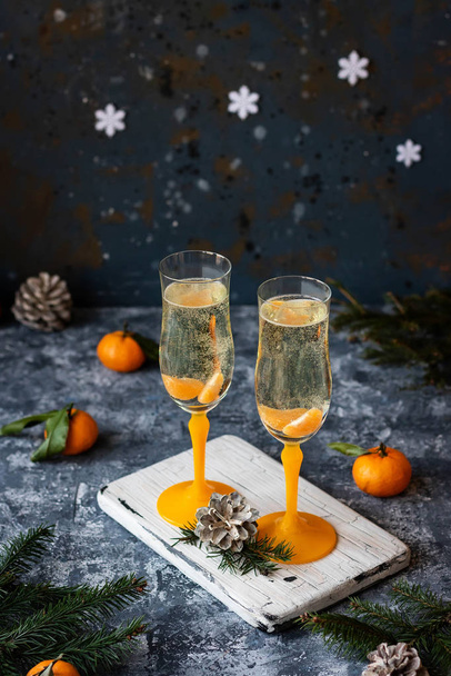 Champagne with tangerines for the New Year's table. - Foto, Imagem