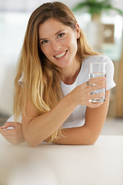 healthy woman holding glass of water - Photo, image