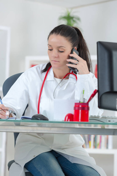 female doctor on the phone - Фото, изображение