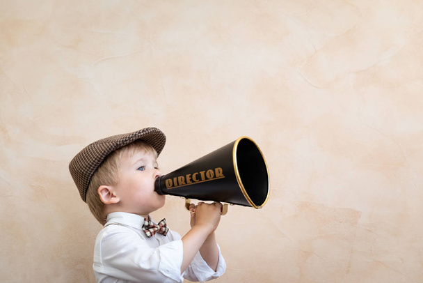 Child shouting through vintage megaphone - Zdjęcie, obraz