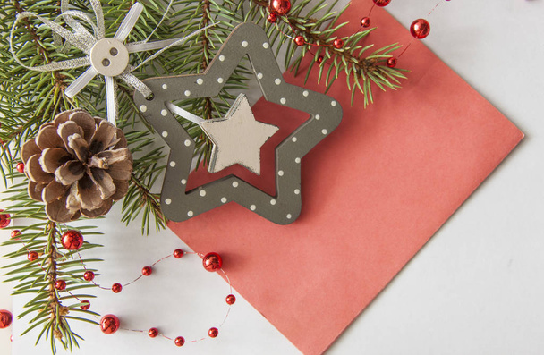 Creative layout made of Christmas tree branches with blank paper card note. Flat lay. Nature New Year concept. - Foto, Bild